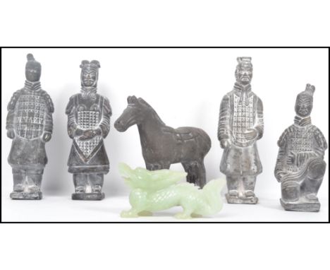 A vintage Oriental Chinese part Terracotta army consisting of soldiers and horse along with a jade carving of a dragon. Measu