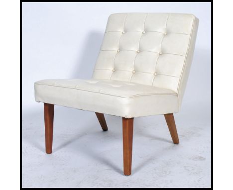 A vintage retro 20th century Mies Van De Roe inspired white cream button back chair raised on shaped beech legs. Measures: 71
