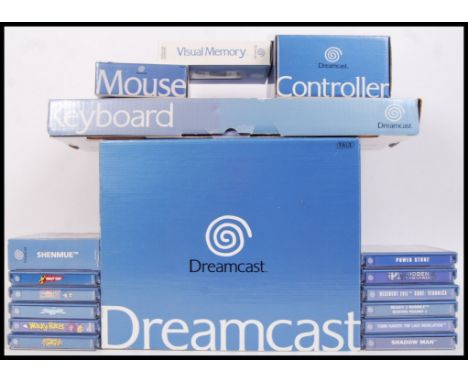 An original Sega Dreamcast Console along with keyboard, mouse, controller all within their original boxes & games to include;
