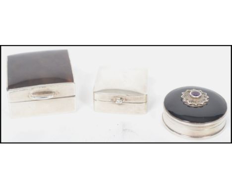 Two vintage 20th century silver pill boxes one of rectangular form having a faux tortoise shell lid, and another of similar p