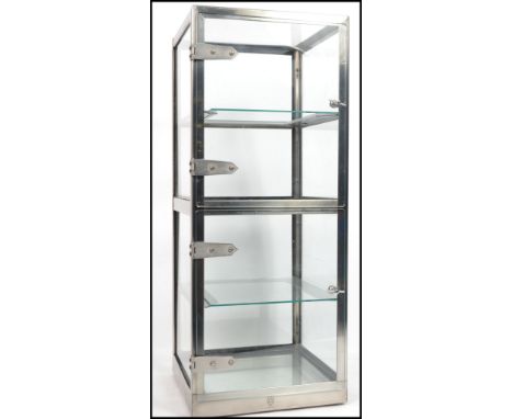 A retro vintage 20th century industrial steel and glass display cabinet fitted with three shelves and glass door. Makers stam