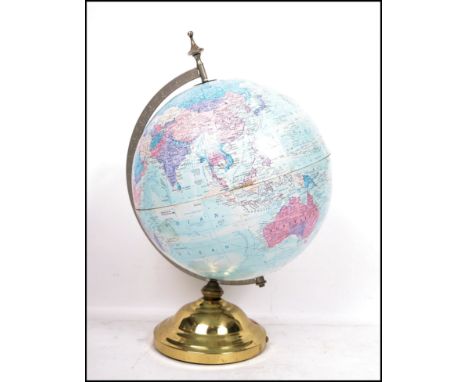 A vintage 20th century retro Globe Master globe raised on a brass circular base. Measures 48 cm high.