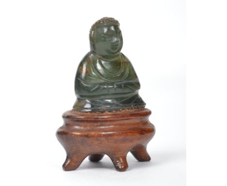 A vintage Oriental Chinese jade Buddha raised on a stone socle plinth. Measures 3.5 cms high.