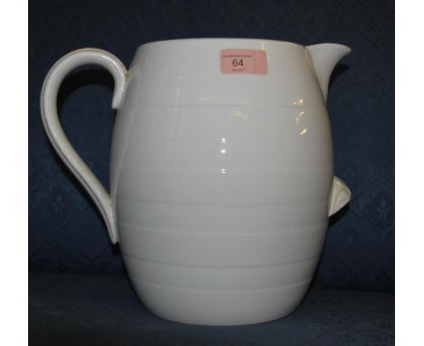 An early 20th century ceramic farmhouse cream milk dairy jug having a white glaze with banded decoration shaped handle and li