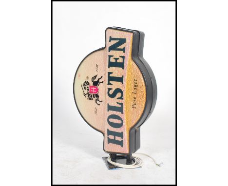 A 20th century Holsten beer advertising light box sign with good shape and coloured plastic facia's having bracket mount. Mea