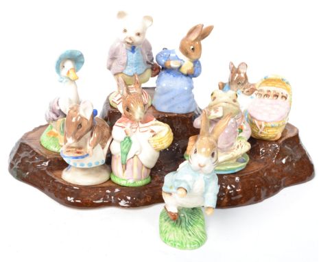 A collection of 20th century Royal Albert ceramic figures to include Hunca Munca, Pigling Bland, Mrs Roberts, Appley Dapply, 