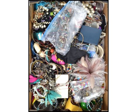 A large collection of vintage and contemporary costume dress jewellery to include bracelets, beads, bangles, rings etc. Pleas