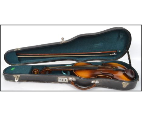 A vintage 20th century Czechoslovakian Stradivarius copy violin with label to interior complete in carry case with bow. 