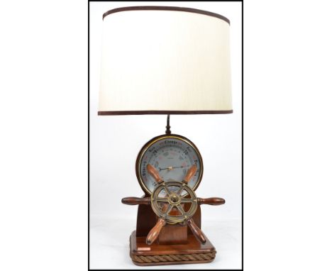 An unusual 20th century nautical themed Shortland Brothers brass mounted mahogany desk barometer, incorporating an electric l