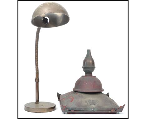 A vintage retro 20th century goose neck anglepoise lamp raised on circular base along with a vintage DW Windsor Street lamp t