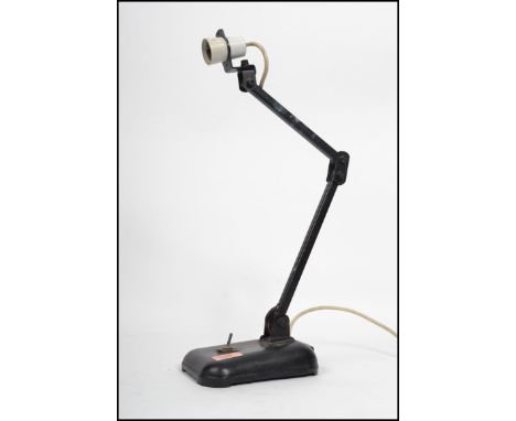 A vintage industrial table top anglepoise desk lamp having a pendant shade with adjustable arm affixed base. Measures 54 cm h