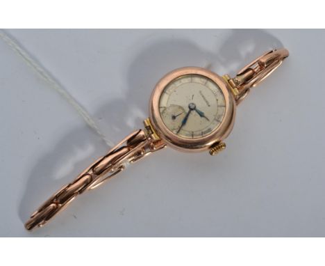 A 9ct gold vintage Longines wrist watch set to an expanding 9ct gold bracelet, Total weight 20.6 grams.