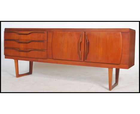 A superb vintage mid century teak wood sideboard, fitted three drawers to the left with double cupboard to the right, detaile