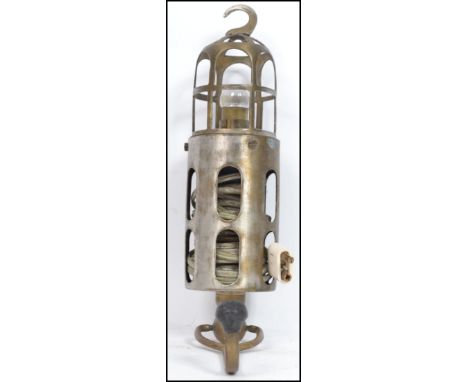 An original early 20th century Joseph Lucas trouble / cage inspection lamp with polished steel and brass construction having 