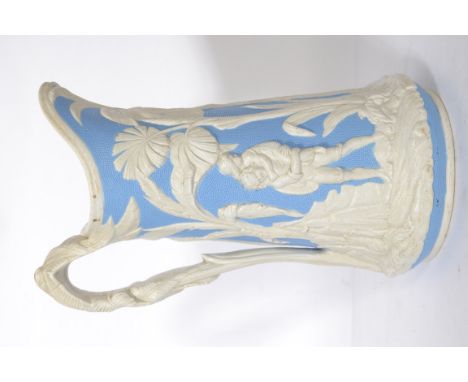 A 19th century Dale Hall Longport ceramic ewer jug having a white and blue ground moulded in relief with scenes of figures an