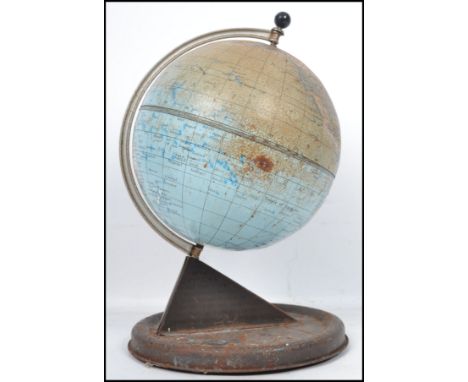 A mid 20th century desk top tin globe by Chad Valley having a sundial base. Measures: 28cm high x 20cm deep. 