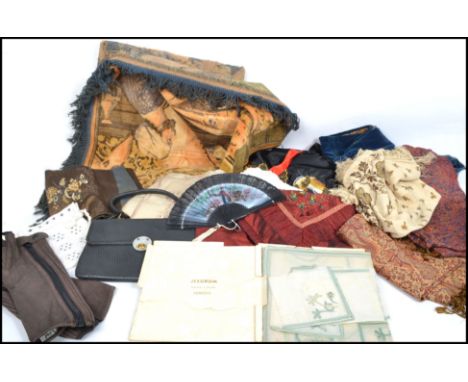A large quantity of vintage textiles to include large wall hanging, Japanese embroidered dressing gown etc.