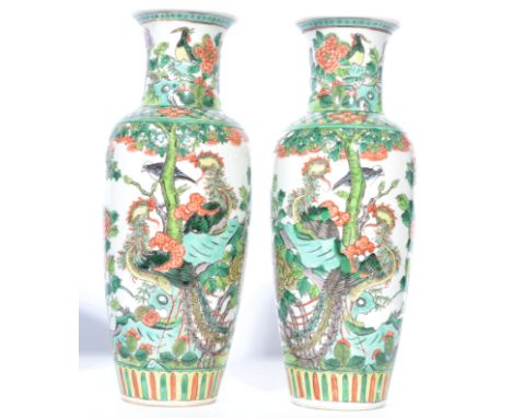 A pair of late 19th / early 20th century Guangxu Oriental Chinese ceramic famille verte vases having a white ground decorated
