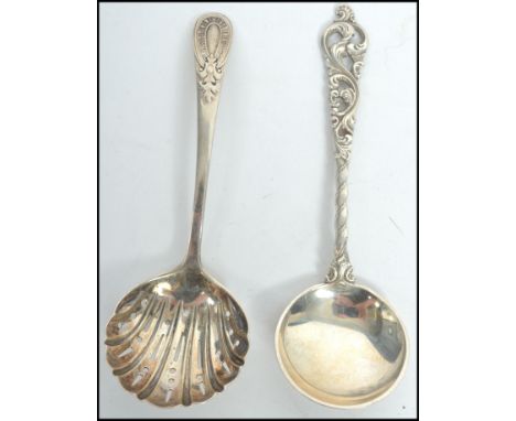 A silver hallmarked caddy spoon strainer with pierced bowl being hallmarked for James Dixon & Sons, Sheffield together with a