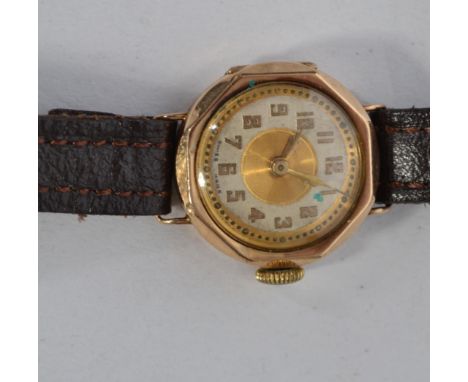 A vintage 9ct gold ladies bracelet strap dress watch having decorative roundel case and face, set to a leather strap