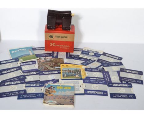 A vintage mid 20th century bakelite view finder with several stereo pictures to include New York, Niagra Falls, Switzerland, 