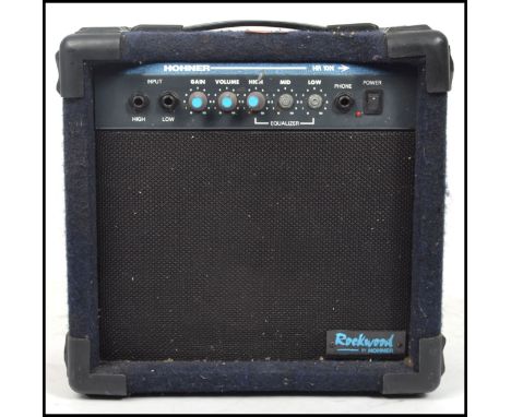 A 20th century Hohner cased amp - amplifier model no HR10N with carry handle atop and dial facia over speaker. Measures 33 cm