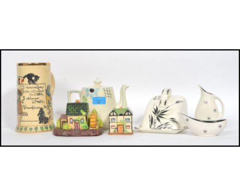 A collection of mixed vintage 20th century ceramics to include a Japanese ceramic cruet set in the form of a water mill, a Ja