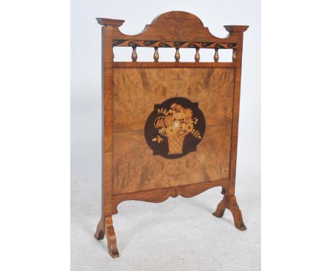 A 19th century Victorian Arts and Crafts wooden firescreen inlaid with specimen woods and decorative central panel with mothe