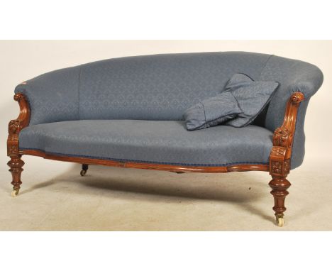 A good Victorian mahogany Chesterfield sofa settee being raised on cabriole legs with ceramic castors. The rococo scrolled fr