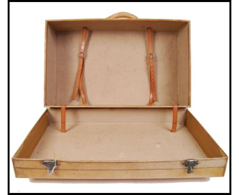 A vintage 1940s post-war cream leather suitcase of large proportions, with hinged top opening to reveal tan leather securing 