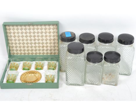 A collection of seven vintage 20th century Hygena kitchen storage jars, each with the Hygena logo flashing across the front t