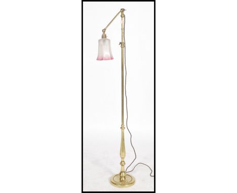 A vintage 20th century metamorphic adjustable floor lamp,  adjustable upper arm with fitted ball joint for direction surmount