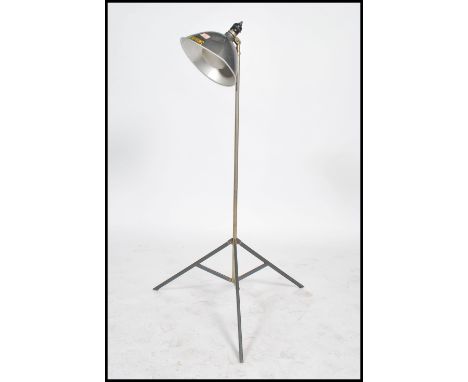 A vintage / retro floor standing lamp, converted from a Smith Victor camera light having a polished aluminium pendant shade r