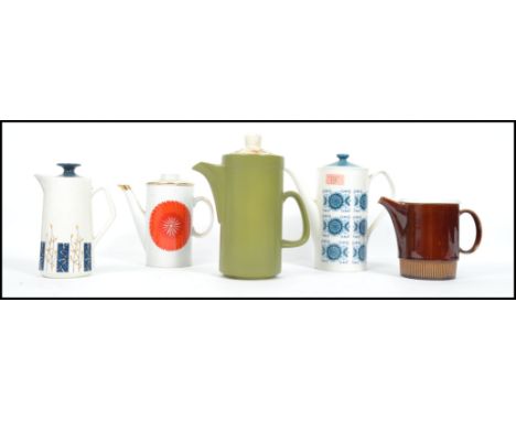 A collection of 5 vintage / retro ceramic teapots along with others etc ( please see images ). Highest measures 25 cm.
