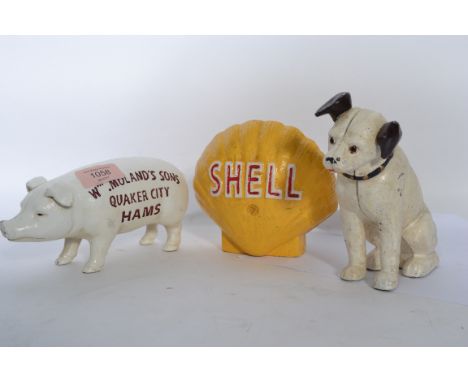 A group of three vintage 20th century cast iron novelty advertising money boxes, to include Quaker city hams pig, HMV dog and