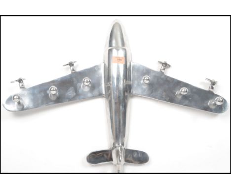 A vintage 20th century Art Deco style retro chrome set of coat hooks in the form of an aeroplane with moving propellers. Meas