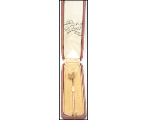 Hunting interest - A gold metal fox head tie pin, having rose diamond chip eyes,spiralled shaft presented in original present