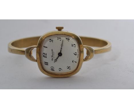 A sterling silver Tissot Le Logle ladies dress watch having a silver 925 rigid bracelet with hidden clasp. The enamel face ha