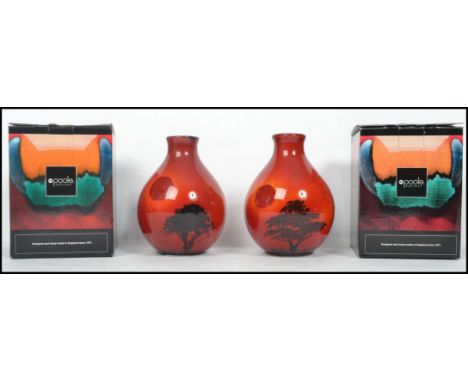 A pair of matching Poole Pottery dump stem vases in the African Sky pattern, both in original boxes and stamped to base. Meas