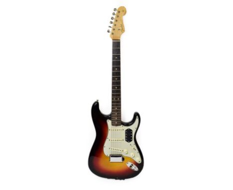 Fender Stratocaster Guitar (1963) serial no.L17506 on four screw plate, black sunburst finish with white scratchplate, four s