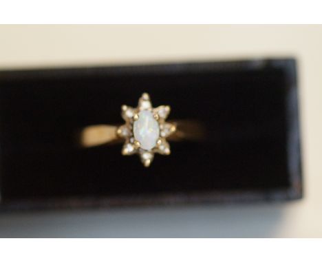 9ct gold ring set with opal and diamonds