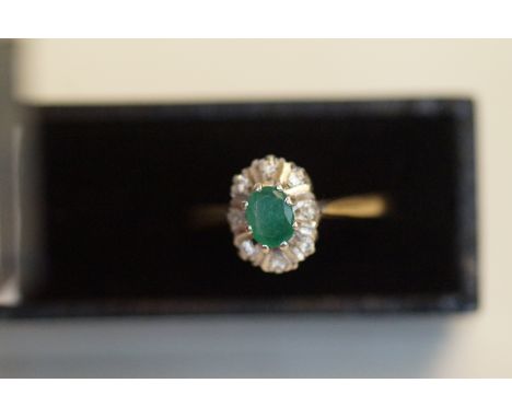 9ct gold ring set with emerald and diamonds