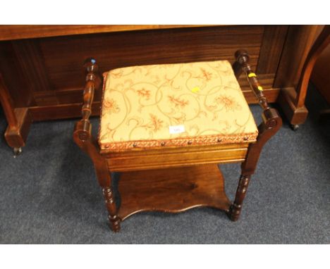 AN OAK PIANO STOOL 