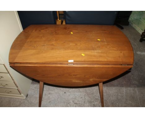 AN ERCOL STYLE DROP LEAF TABLE 