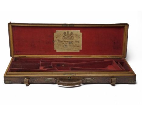 JAMES WOODWARD &amp; SONS A BRASS-CORNERED OAK AND LEATHER SINGLE GUNCASE WITH PROVISION FOR EXTRA BARRELS, fitted for two se