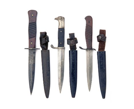 THREE GERMAN WWI BOOT or TRENCH-KNIVES, including an unsigned spearpoint example with ribbed wood grip and webbing and leathe