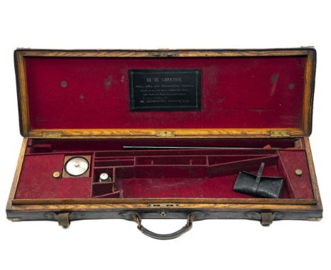 A BRASS-CORNERED OAK AND LEATHER SINGLE SMALL-BORE GUNCASE, fitted for 27 1/4in. barrels, the interior lined with red baize, 