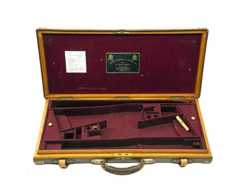 JAMES PURDEY &amp; SONS A BRASS-CORNERED LEATHER DOUBLE GUNCASE, fitted for 28in. barrels, the interior lined with maroon bai