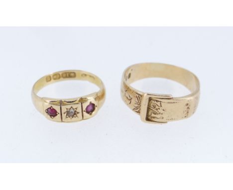 TWO 18CT GOLD RINGS comprising 18ct gold belt buckle design ring and an 18ct gold ruby and diamond three stone ring, 7.7gms o