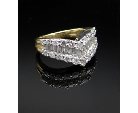 18CT GOLD DIAMOND ARROWHEAD RING, having three rows of round and baguette cut diamonds, ring size H, 6.1gmsProvenance: deceas